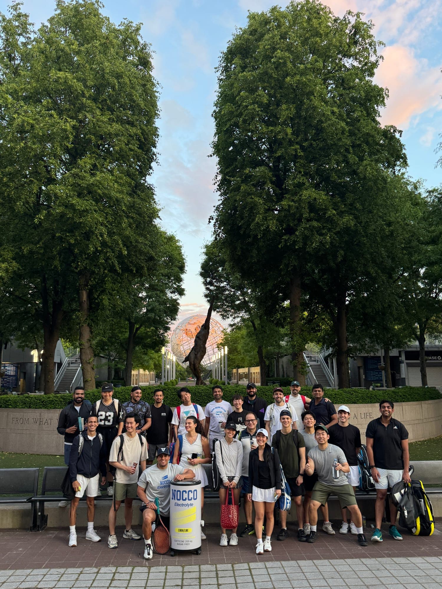 The Deuce crew at Flushing Meadows at sunset, the Unisphere behind them