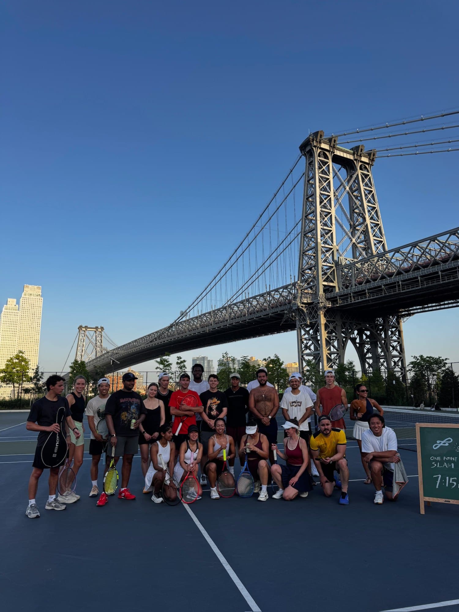 Deuce players on the courts under the Williamsburg Bridge