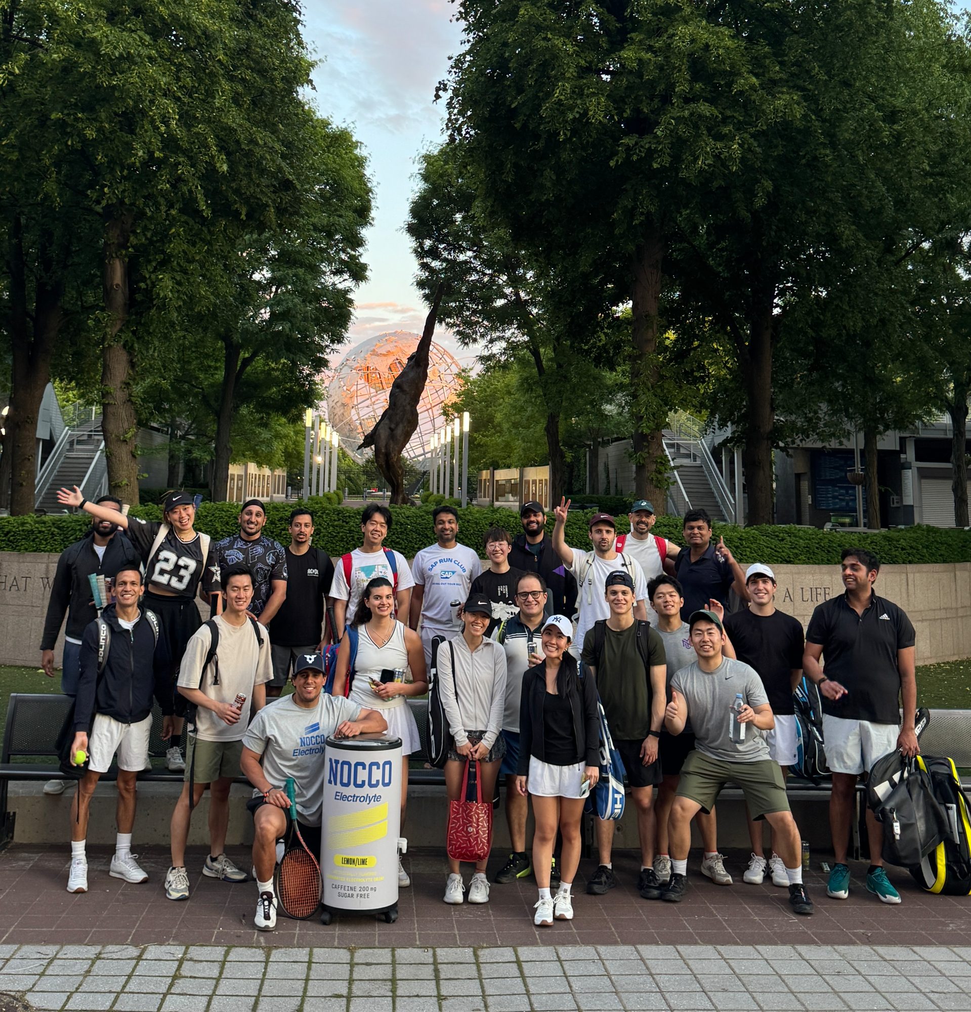 The Deuce crew at the US Open grounds, with the Unisphere behind